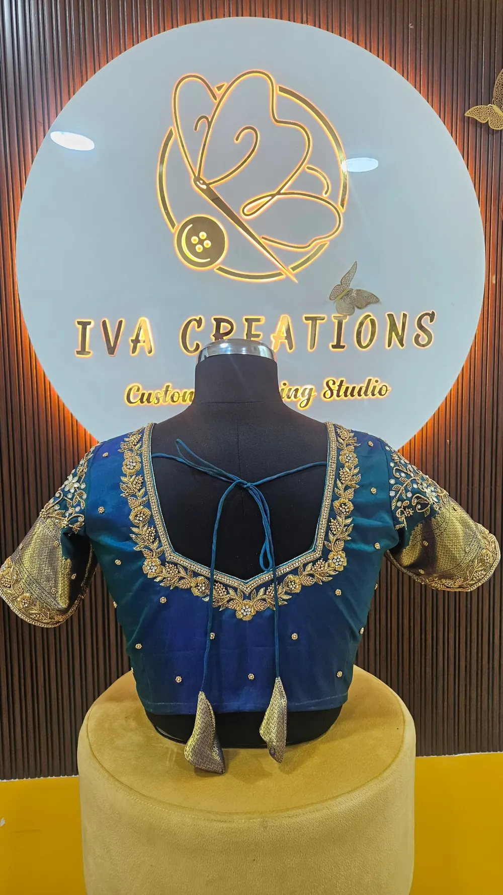 Peacock blue bridal blouse with Aari work and tassel ties