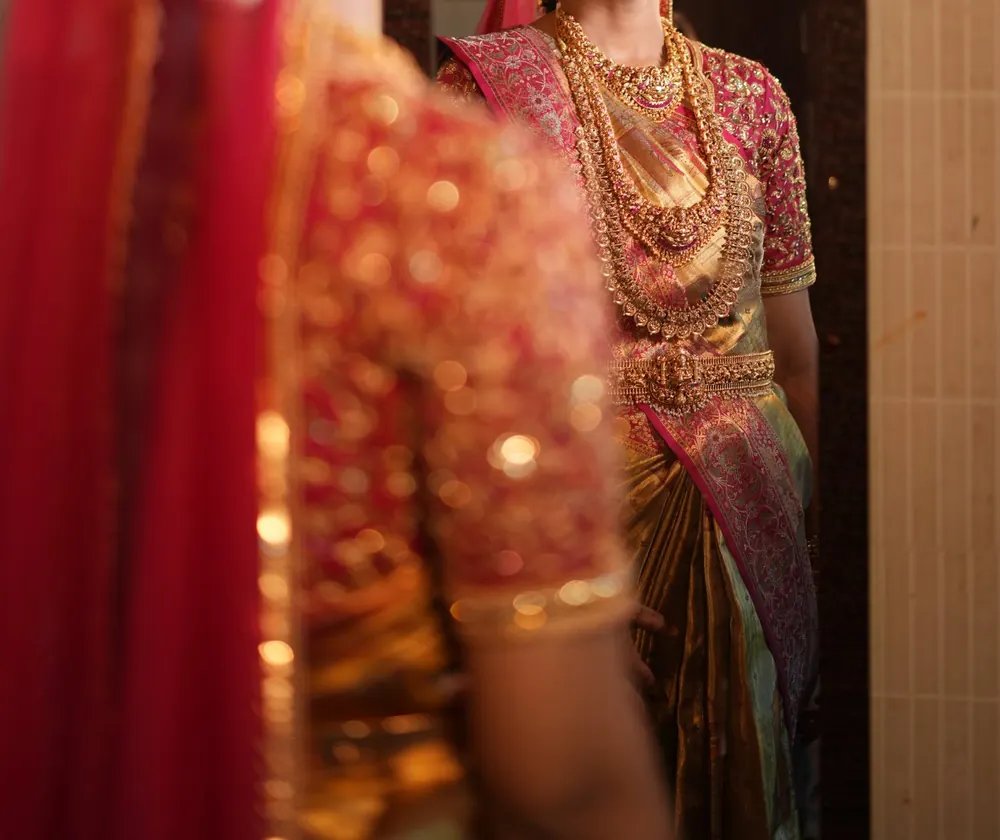 Kanchipuram silk saree with a hand-embroidered blouse and temple jewellery