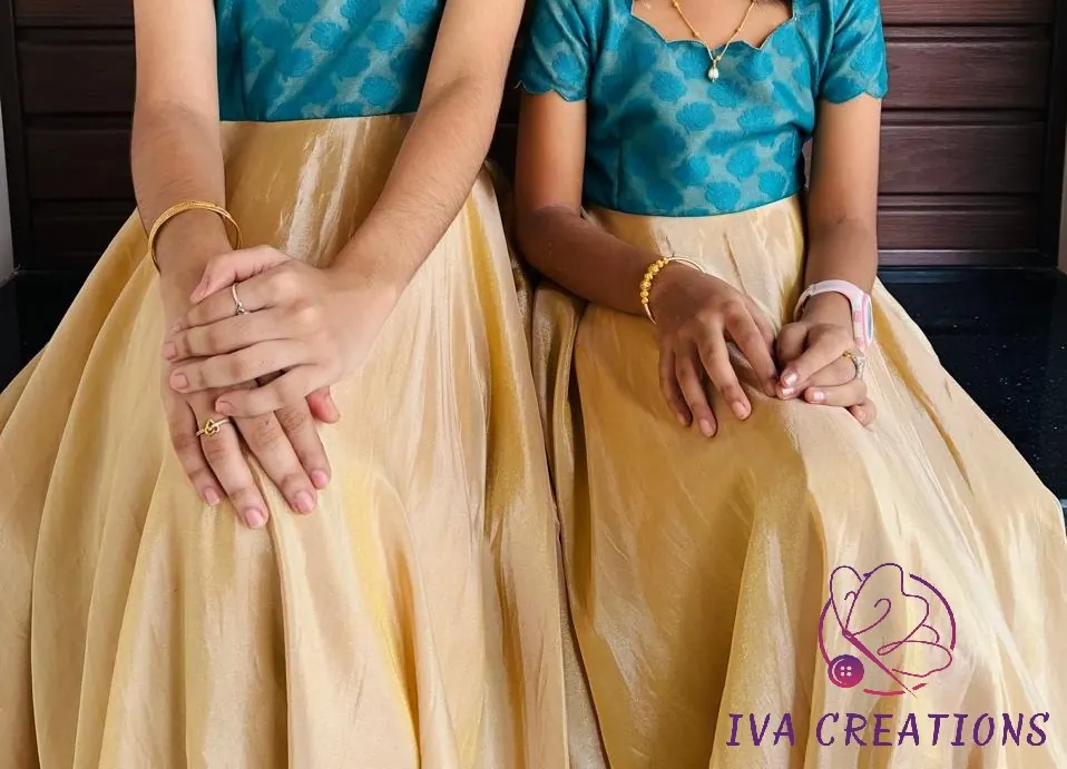Matching gold tissue gowns with teal brocade tops