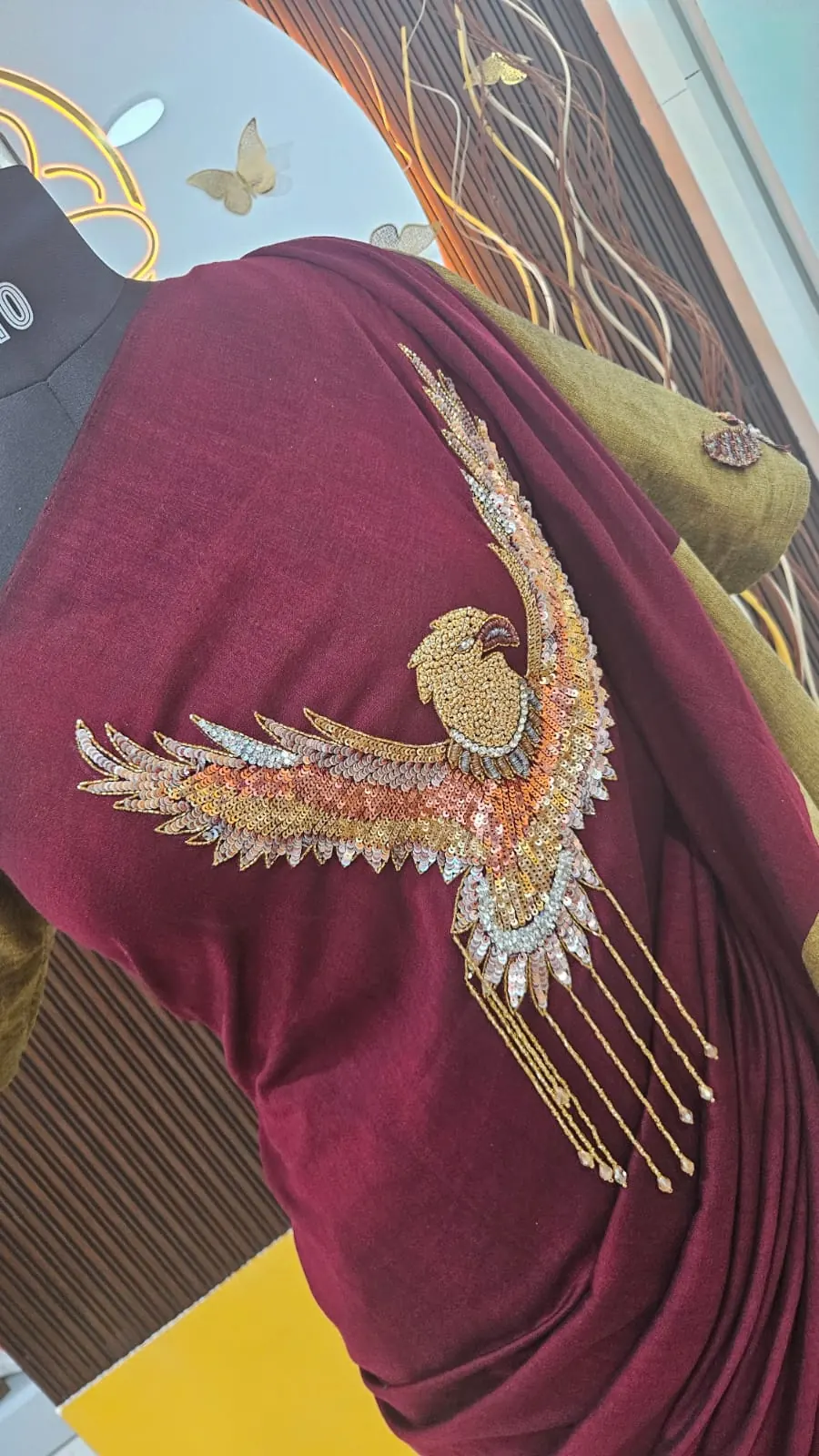 Hand-embroidered bird motif on a saree
